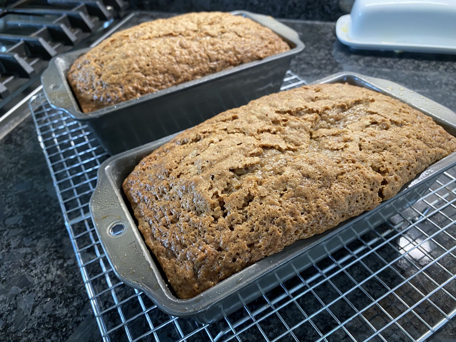 A golden loaf of savory zucchini cheese bread sliced to show its moist interior.