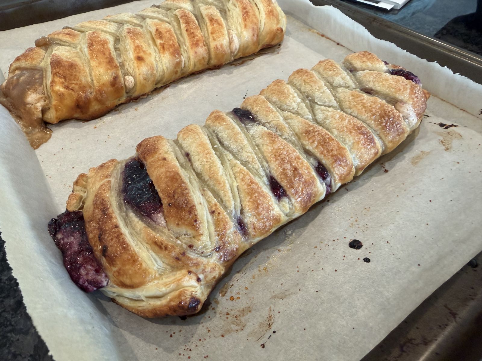 Golden puff pastry filled with muscadine cream cheese swirl.